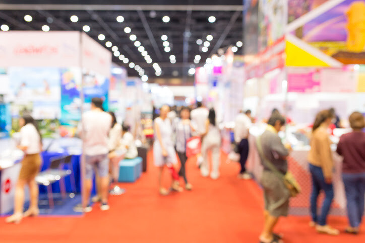 People milling about at a large tradeshow