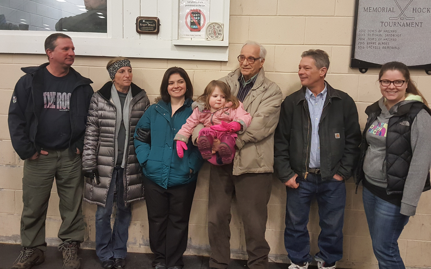 Roger Brault and family stand by plaque at BOR